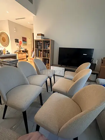 Set of 6 beige upholstered dining chairs with black legs - good condition