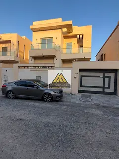 The villa features 3 or 5 master bedrooms, a majlis (formal sitting room), 3 living rooms, a maid
