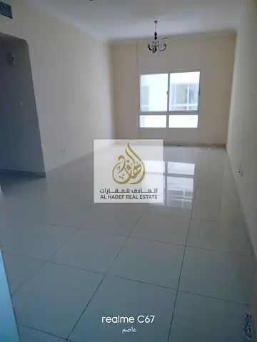 Annual rent in Ajman, Al Nuaimiya 1 area, near Al Hikma School. The building is suitable for families and features two bedrooms, a living room, centra