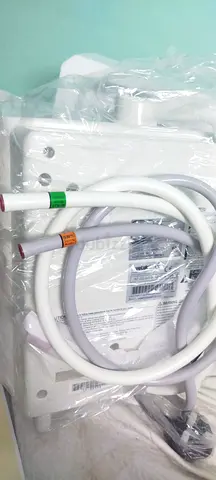 Brand new water cooler / dispenser with installation hoses (unused)