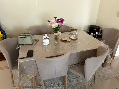 Glass dining table with 6 upholstered chairs - light grey set. Excellent condition.