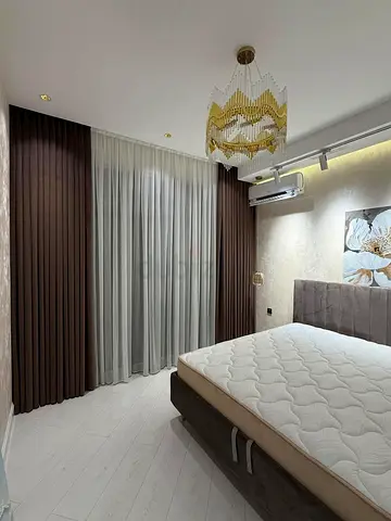 Pair of Floor-to-Ceiling Brown Fabric Curtains with Sheer Liners