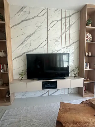 Samsung 65” QLED 4K Smart TV mounted on entertainment unit - great condition