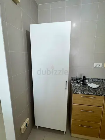 Slim white wardrobe / storage cabinet — good condition