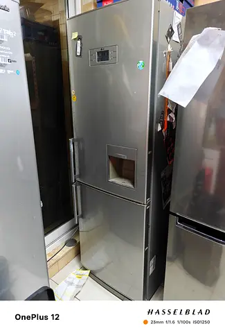 LG stainless steel refrigerator with bottom freezer. the freezer plastic drawer has a crack .