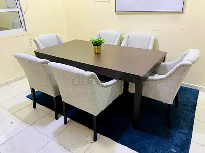 Dining table with 6 upholstered chairs - solid wood top, good condition free delivery all UAE