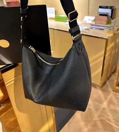 Tory Burch leather shoulder bag — spacious everyday hobo bag
