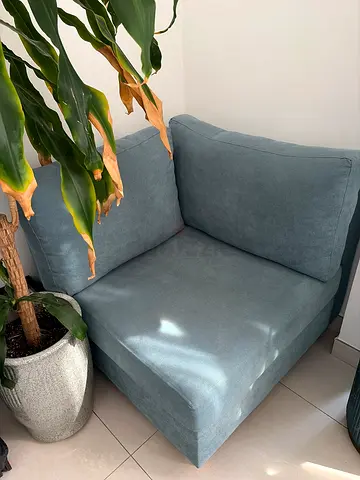 Single modular corner sofa seat in light blue fabric — good condition.