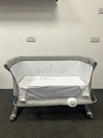 Brand New - Jikel Nova baby bedside bassinet /co-sleeper in grey with musical panel and mosquito net