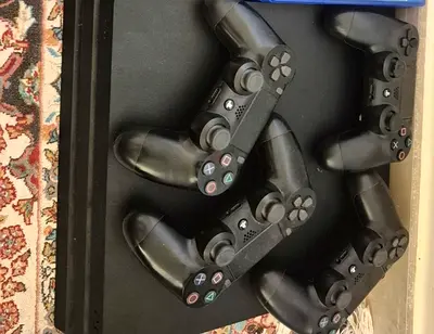 PlayStation 4 Slim with 4 DualShock 4 controllers - Good working condition