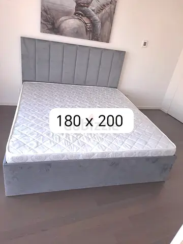 Grey upholstered double bed frame with mattress (180 x 200)