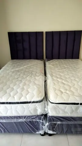 Pair of single beds with mattresses and padded headboards - excellent condition