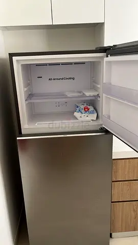 Compact stainless steel refrigerator with top freezer - good condition