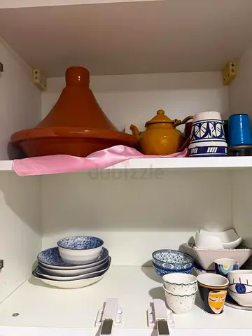 Kitchen cabinet set: tagine, teapot and assorted dinnerware
