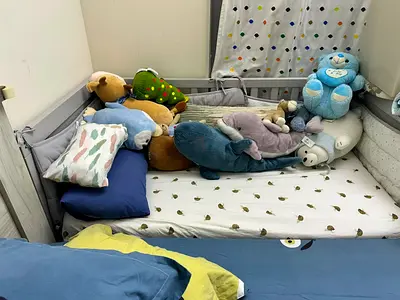 IKEA Baby Bed with Mattress and 2 Bed Sheets, along with baby automatic toy spinner - AED 450