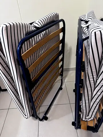 Pair of Foldable Ikea Guest Beds with Striped Mattresses