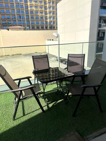 4-piece outdoor balcony dining set with glass table and mesh chairs