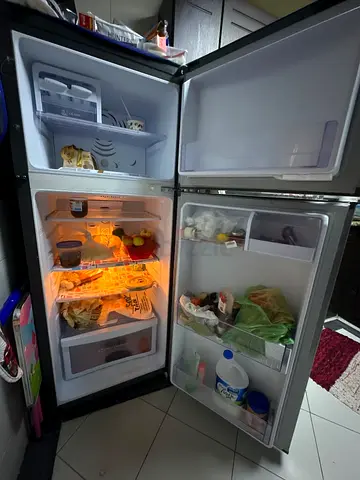 Used double-door refrigerator in good working condition