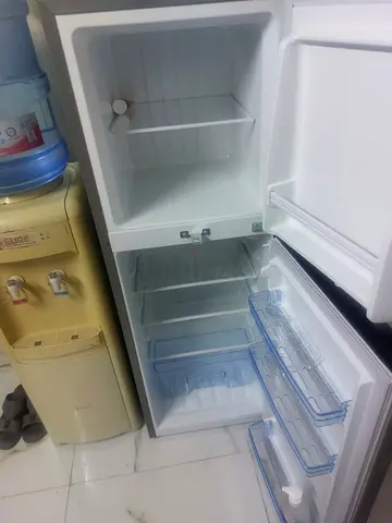 Used two-door refrigerator with freezer - good working condition new one