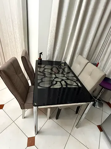 Glass-top dining table with chrome legs (seats 6) - good condition