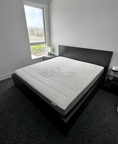 IKEA malam king‑size bed (180 × 200 cm) with 2 storage drawers and an IKEA mattress