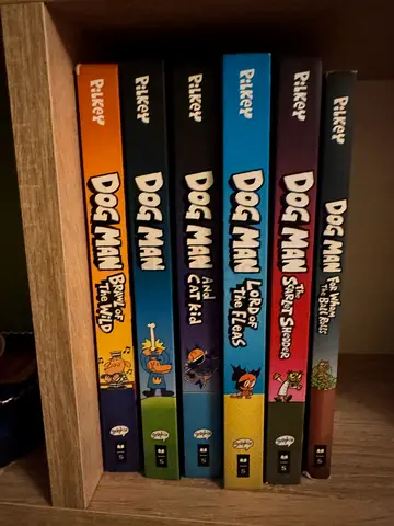 Set of 8 Dog Man Graphic Novels by Dav Pilkey - Good Condition. All hard cover except 2