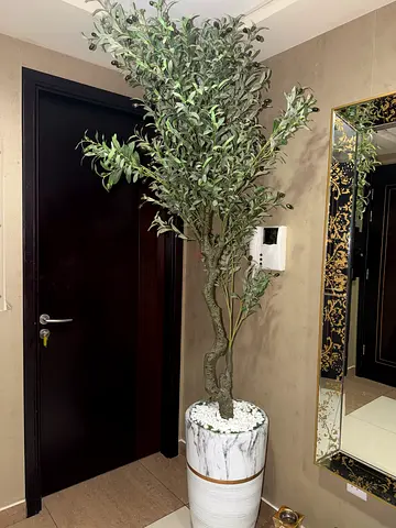 Tall artificial olive tree in decorative marble pot - excellent condition