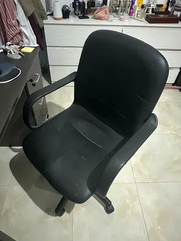 Black ergonomic office chair with armrests - used