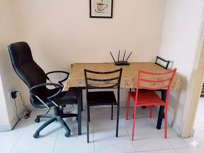 Dining table with mixed chairs — small set, good condition