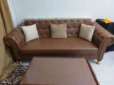 Brown tufted faux leather 3-seater sofa with cushions