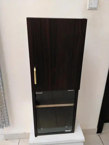 Slim tall cabinet with glass door - dark wood finish