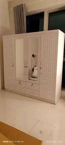 We are selling 4 door wood wardrobe brand new available