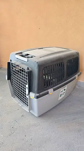 1 Large and 1 small plastic pet carrier / travel crate - good condition just dusty