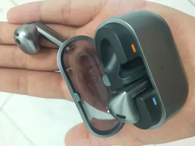 Used wireless earbuds with charging case (pair) - good condition