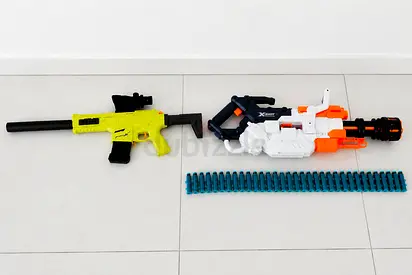 Pair of foam dart blaster guns with extra ammo belt — used
