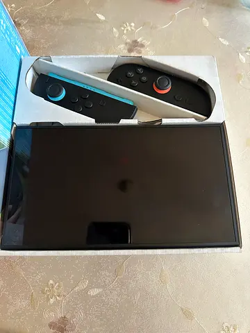 Nintendo Switch Console with all accessories  and Super Mario Kart World with 1 year warranty.