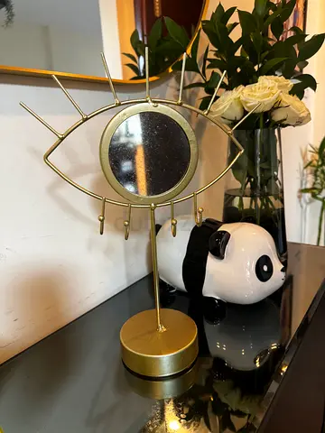 Decorative gold eye-shaped tabletop mirror