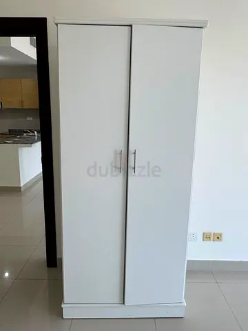 Simple white two-door wardrobe in good condition