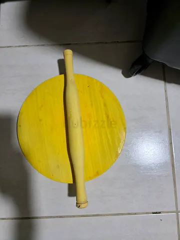 Wooden rolling pin and round board for dough