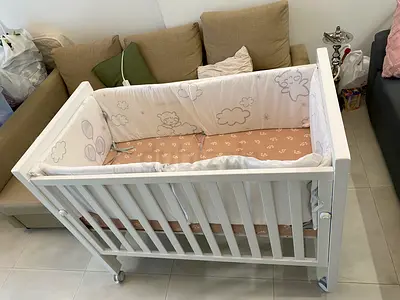 White wooden baby crib / bedside co-sleeper - good condition