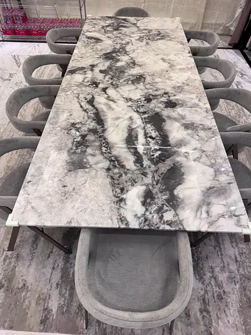 Modern marble dining table with sculptural wooden pedestal legs - Al Huzaifa Brand