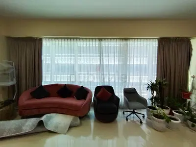 Pair of brown patterned blackout curtains with white sheer liners