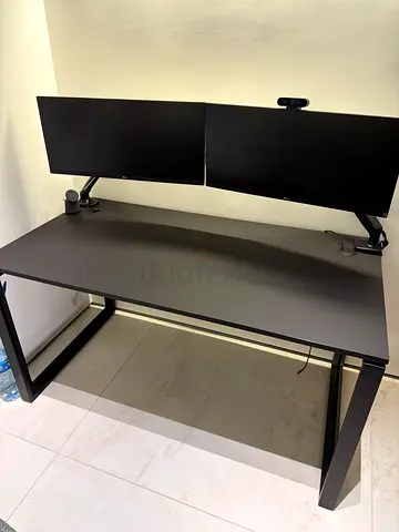 Minimalist High End Black Office Desk with Dual LG Monitors and Camera (workspace.ae)