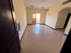 Master bedroom and living room with open view in Al Muwaihat 2 For annual rent: A one-bedroom apartm