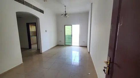 Two BR Al Qasimia Station balcony security cheque 6 cheques family building prime location.