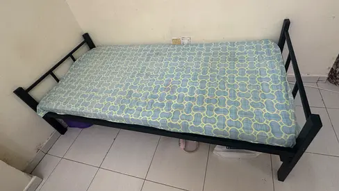 Metal platform bed for sale, including medical bedsheet