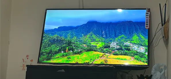 Urgently selling 43-inch Smart LED TV in Good Working Condition with new wall mounted tv stand free