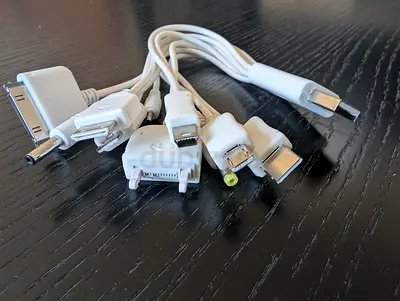 Universal multi-connector charging cable with multiple adapter tips