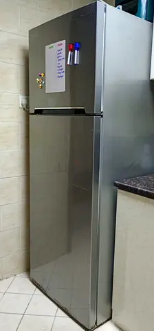 Silver double-door fridge with top freezer - good working condition