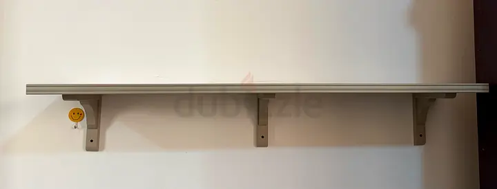 Wall-mounted storage shelf with three brackets - neutral wood finish